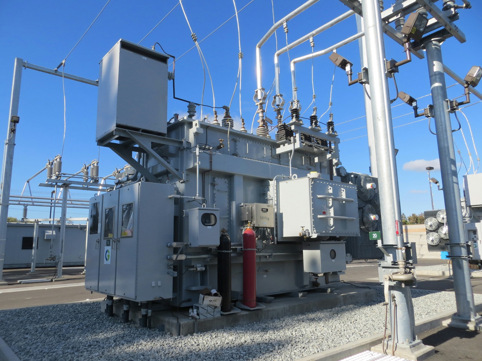 A municipal electrical substation with a large transformer and overhead lines.